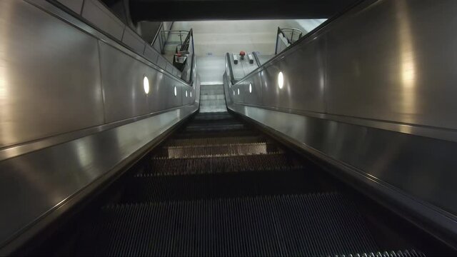 POV Riding Down Escalator. Follow Shot