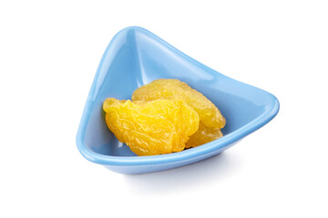 Dried pear fruits in blue bowl isolated on white background