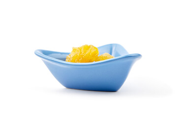 Dried pear fruits in blue bowl isolated on white background