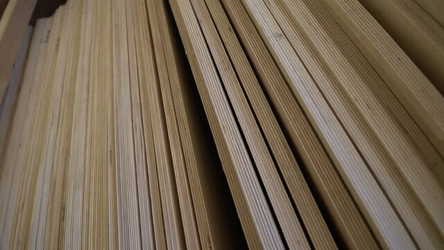 Plywood in stock. Sheet building material for the construction of partitions. Wooden plywood for building a house.