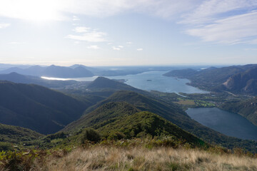 Lake maggiore and lake mergozzo seen from the mountains of val d'ossola during a summer day, near the town of Mergozzo, italy - September 2020.