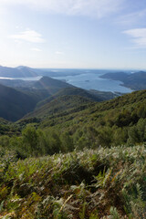 Fototapeta na wymiar Lake maggiore and lake mergozzo seen from the mountains of val d'ossola during a summer day, near the town of Mergozzo, italy - September 2020.