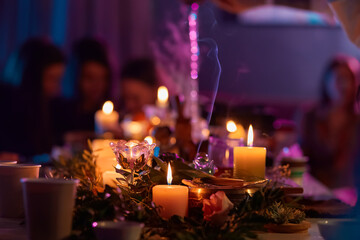 Tea ceremony, candles roses and stones, spa relaxation. Pours boiling water into a teapot. Muffled light
