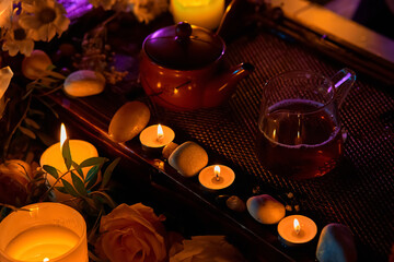 Tea ceremony, candles roses and stones, spa relaxation