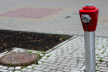Fire hydrant pole on the city street installed in the middle of the bridge