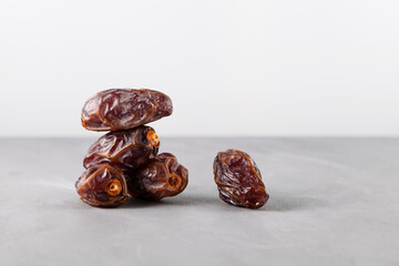 Large Iranian dates. Natural substitute for sweets. Healthy food during religious fasting. Dried fruits contain a lot of vitamins and trace elements. Selective focus, copy space