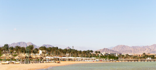 An empty beach in Egypt during the COVID 19 pandemic. The Red Sea coast, a recreation area without people.