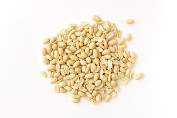 Arranged peanuts peeled and isolated on white background.