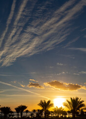 Fototapeta premium Sunrise on the sea coast. The movement of the sun and clouds across the sky.