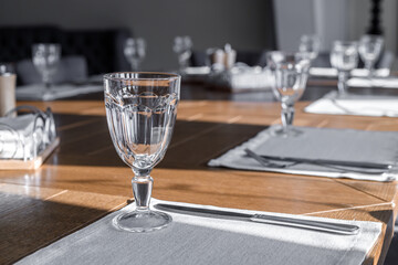 Empty wine glasses are on the table in the restaurant.