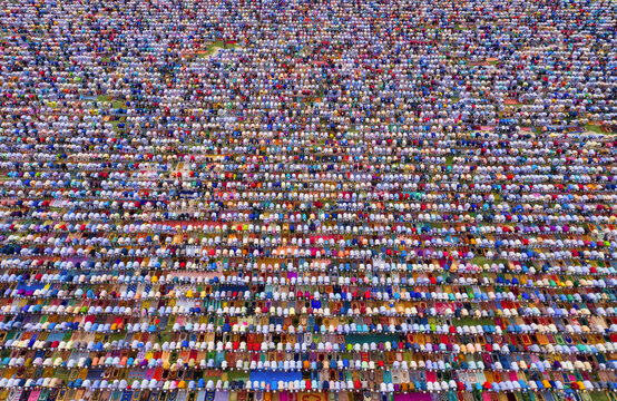 Aerial view of a vast crowd of people worshipping at Gore Shahid park in front of Eid Gah Minar religious site in Dinajpur, Rangpur, Bangladesh.