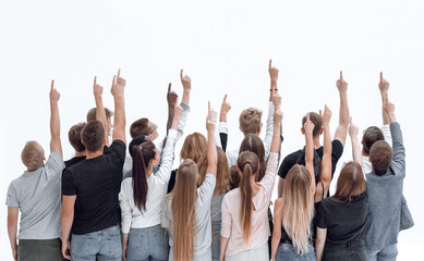 large team of young people pointing somewhere up .