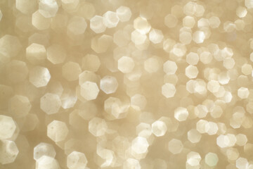 Gold giltter bokeh. Background for celebration card. Glowing backdrop.