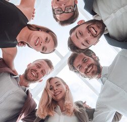 close up. group of young business people standing in a circle.