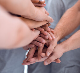 close up. young people making a tower of hands.