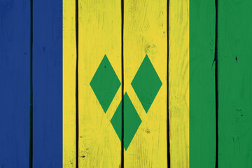 national flag of Saint Vincent and the Grenadines on wooden texture