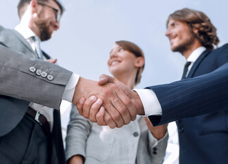 in the foreground.handshake of business partners