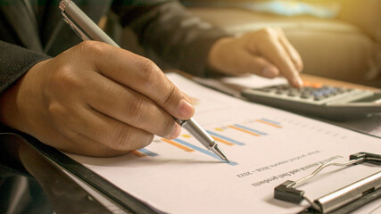 Business people reviewing reports, financial documents for analysis of financial information, work concept.