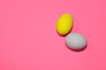 Two easter eggs on pink backround
