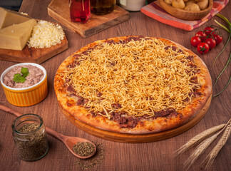 Pizza with beef and cream, mozzarella cheese and potato sticks - Traditional brazilian pizza de strogonoff.