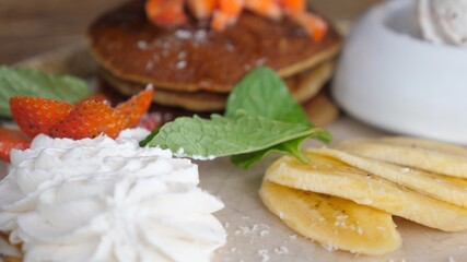 Close up os sweet breakfast of plant based pancakes and dairy free ice cream