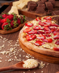 Sweet pizza strawberry with white chocolate - Traditional brazilian pizza de morango com chocolate branco - Closeup.