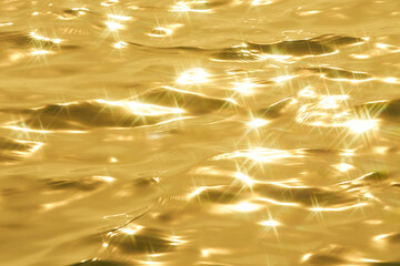 Detail of a sunlight reflecting in glittering sea. sparkler in water - background. sea water with...