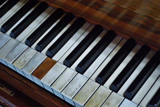 Old Worn Out Piano Close Up Of Missing Keys