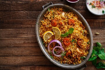 Homemade Prawn Shrimp biryani served with Yogurt Raita and beet pickle