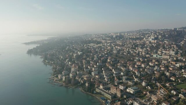 Stunning aerial of beautiful coastal city. Shot in Pully, Switzerland