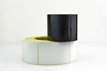 White roll of labels for thermal perforation and Ribbon, thermal transfer dye tape. Stickers for...