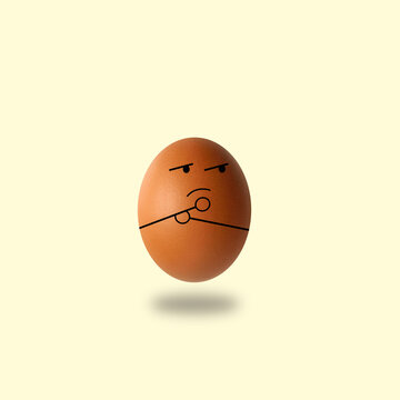 egg thinking on yellow background