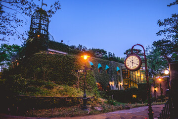 Beautiful view at night in park in Tokyo with Ghibli Museum, lights, watch and sky, Tokyo, Japan