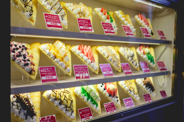 Glass display case with delicious sweet creepes and pancakes at Akihabara, Tokyo, Japan