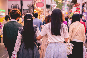 Couple of cute japanese girls in Takeshita Street, Harajuku, Tokyo, Japan - obrazy, fototapety, plakaty