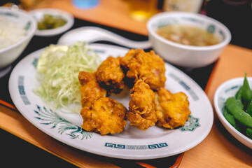 Plate of fried chicken and salad at traditional restaurant in Japan