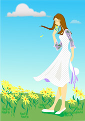 Obraz na płótnie Canvas A girl who smells flowers in a blooming spring field and her hair fluttered in the wind