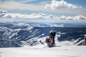 Snowmobiling on mountain