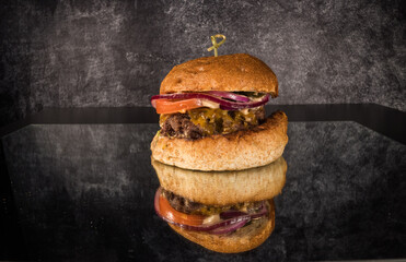 Amazing close-up of a Cheeseburger on a table - food photography