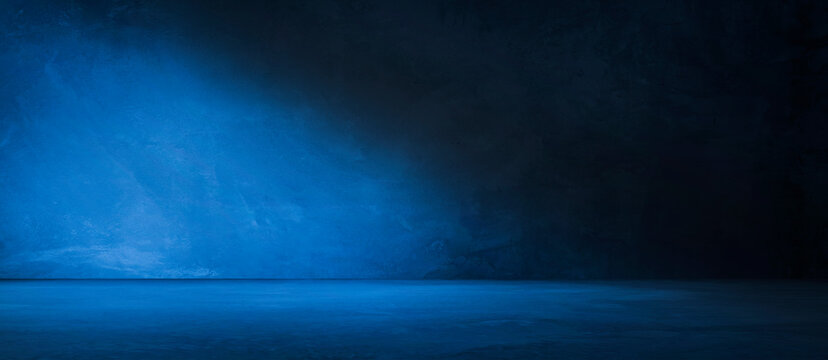 Blue concrete wall and floor with light and shadow backgrounds, use for product display for presentation and cover banner design.
