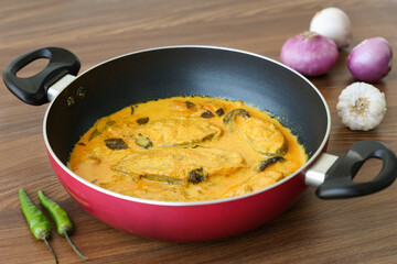 Kerala fish curry coconut milk gravy , cooking spicy Goan fish curry , Indian fish curry Bengali fish curry in coconut milk Kolkata, India Sri Lanka. Lankan food.	