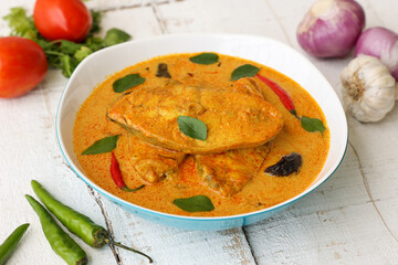 Kerala fish curry coconut milk gravy , cooking spicy Goan fish curry , Indian fish curry Bengali fish curry in coconut milk Kolkata, India Sri Lanka. Lankan food.	