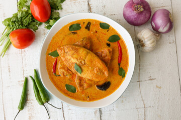 Kerala fish curry coconut milk gravy , cooking spicy Goan fish curry , Indian fish curry Bengali fish curry in coconut milk Kolkata, India Sri Lanka. Lankan food.	