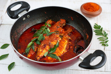 Spicy Mackerel fish curry gravy , cooking spicy Kerala fish curry , Goan red fish curry , Indian fish curry Bengali fish masala curry Kolkata, India Sri Lanka. Lankan food