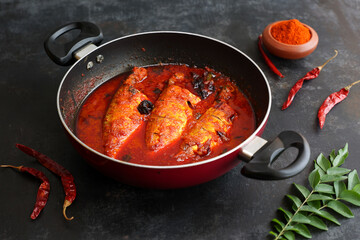 Spicy Mackerel fish curry gravy , cooking spicy Kerala fish curry , Goan red fish curry , Indian fish curry Bengali fish masala curry Kolkata, India Sri Lanka. Lankan food