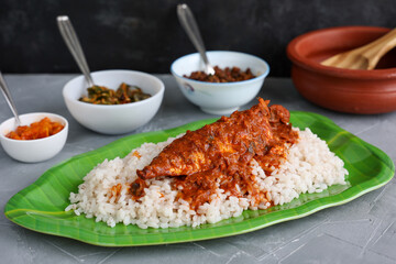 Spicy Mackerel fish curry and rice serving Kerala fish curry , Goan red fish curry , Indian fish curry gravy Bengali fish masala curry Kolkata, India Sri Lanka Lankan food