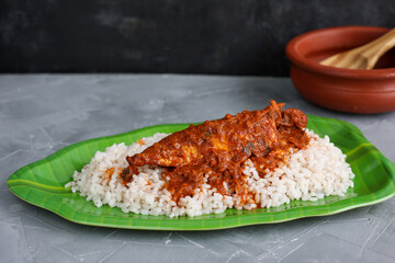 Spicy Mackerel fish curry and rice serving Kerala fish curry , Goan red fish curry , Indian fish curry gravy Bengali fish masala curry Kolkata, India Sri Lanka Lankan food