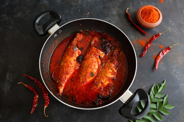 Spicy Mackerel fish curry gravy , cooking spicy Kerala fish curry , Goan red fish curry , Indian fish curry Bengali fish masala curry Kolkata, India Sri Lanka. Lankan food