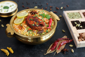 Fish biryani , Spicy and delicious Malabar biryani or Hyderabadi biryani, Dum Biriyani, pulao Kerala India Sri Lanka . basmati rice, herbs, raitha for Ramadan Kareem, Eid