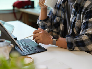 Businessman working with digital tablet in home office room